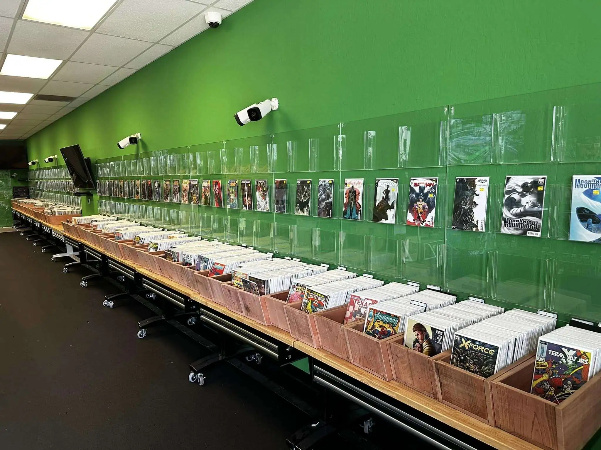 Big Mike's Comix: wall of organized comic inventory